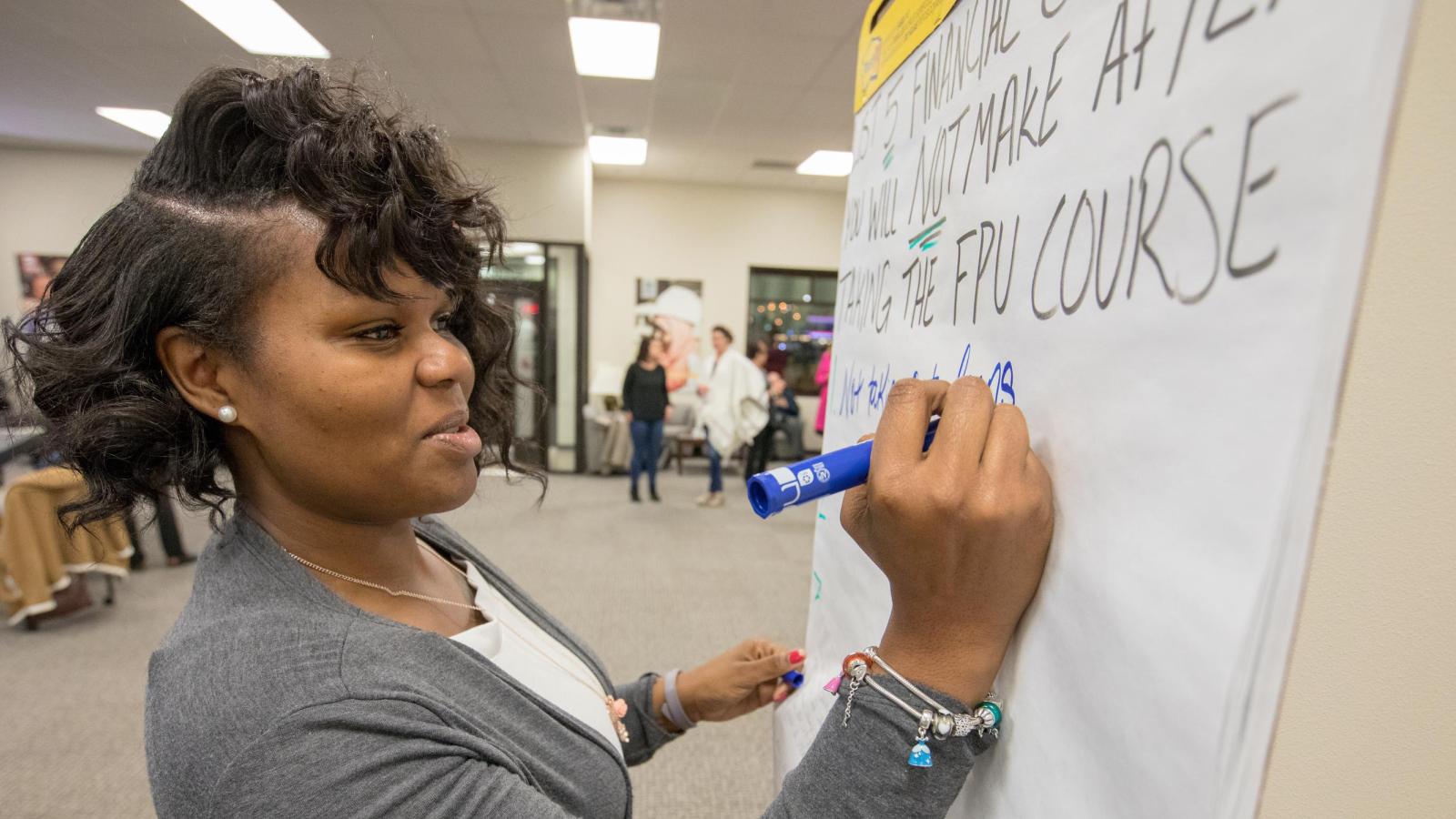 A future homebuyer working through a budget with a Financial Mentor